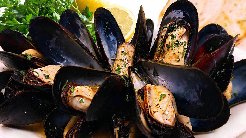 New Sautéed Garlic Mussels · A classic delicacy, one full pound of tender mussels sautéed with scampi butter and served with garlic toast.