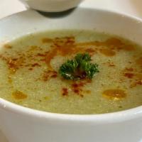 Broccoli Soup · Creamy broccoli soup made with, garlic, onion, white wine, smoked paprika, and olive oil.