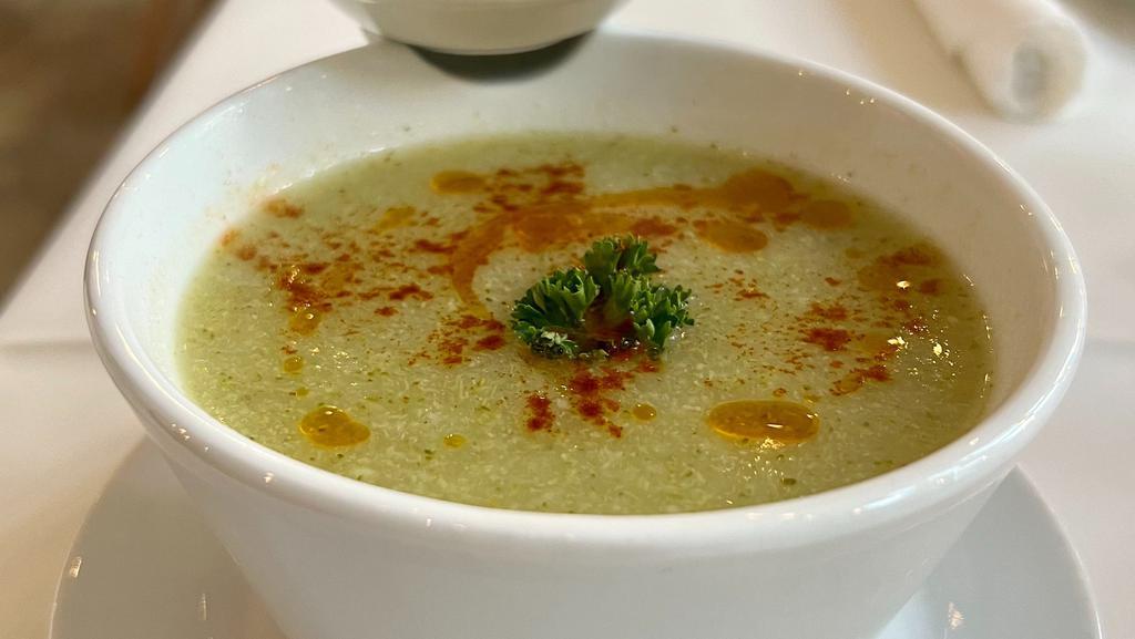 Broccoli Soup · Creamy broccoli soup made with, garlic, onion, white wine, smoked paprika, and olive oil.