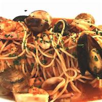Spaghetti Seafood · Spaghetti with tomato sauce, calamari, squid, salmon, clams, mussels, and shrimps.