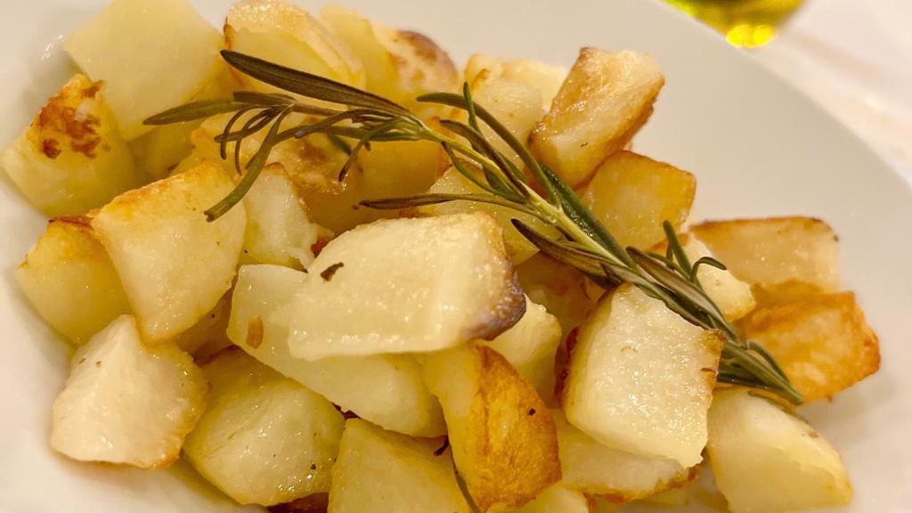 Roasted Potatoes · Roasted potatoes with fresh rosemary.