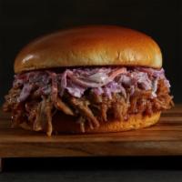 Pulled Pork Sandwich · Mouthwatering pulled pork served on a brioche bun with spicy coleslaw and sweet baby rays BB...
