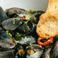 Mussels · Pei mussels, lemongrass broth, and chilis served with garlic bread.