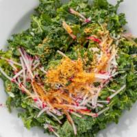 Kale Salad · Cai Xoan  - Kale and toasted shredded coconut with a mango chickpea dressing topped with rad...