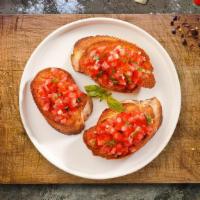 Bruschetta · House baked bread topped with fresh diced tomatoes, pesto sauce, garlic, olive oil, mozzarel...