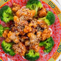 Sesame Chicken · Crispy chunk of breaded chicken in sesame sauce over broccoli. With white rice.