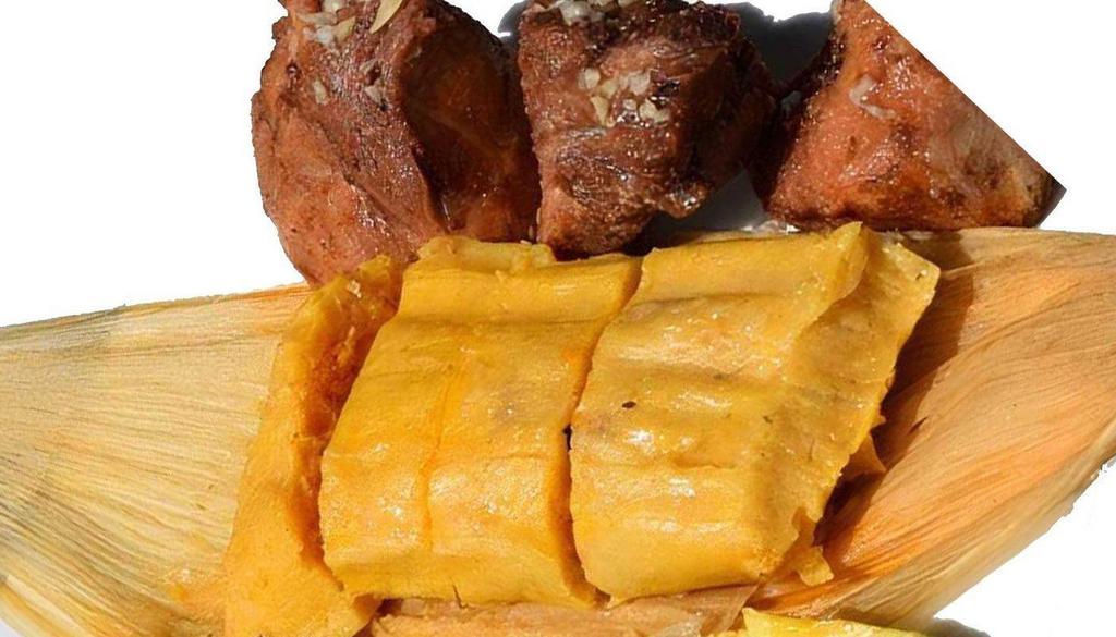 Tamal Cubano Con Masas · Our Famous tamale paired with pork chunks and onions.
Nuestro Famoso tamal maridado con chicharrón y cebolla.