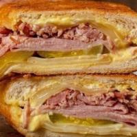 Sandwich Cubano · Our version of this famous international cuban staple :Cuban Style Ham, Pork Leg Ham, Swiss ...