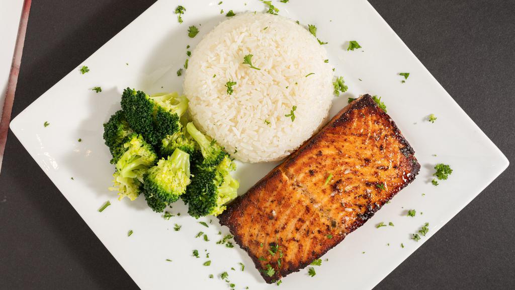 Salmon Fish · Flavorfully marinated with herbs, olive oil, garlic and grilled to perfection served mashed potatoes and steam vegetables.
