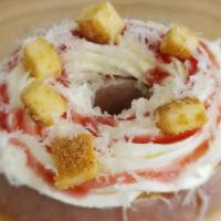 Manchego Cheesecake · Our cheesecake doughnut made with real cheesecake pieces, strawberry sauce and manchego chee...
