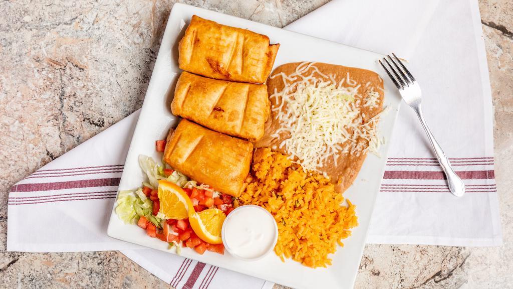 Chimichangas (2) · Served with lettuce, tomatoes, and cheese.