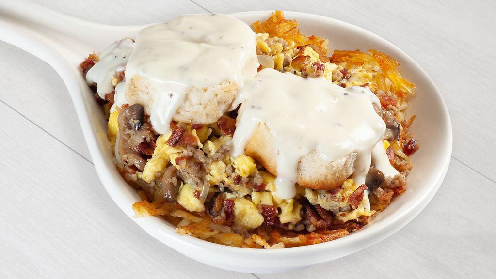 Country Skillet · Seasoned hash brown crumbled sausage bacon mushrooms onions buttermilk biscuit and sausage gravy on top.