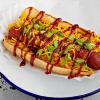 Memphis Dog · BACON WRAPPED HOT DOG, TOPPED WITH SHREDDED CHEESE, BBQ SAUCE AND GREEN ONIONS