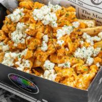 Buffalo Chicken Fries.... Vegan Option Available · Classic Straight Cut fries topped with marinated buffalo chicken,  Monterey jack cheese, sau...