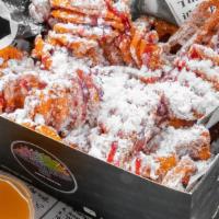 Funnel Cake Fries · Crispy Waffle Sweet Potatoes Fries coated with Powder Sugar and  Flavored Sauce of your choi...
