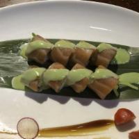 Kamikaze Roll · Shrimp, crab and cucumber wrapped in seaweed; covered with salmon and topped with spicy wasa...