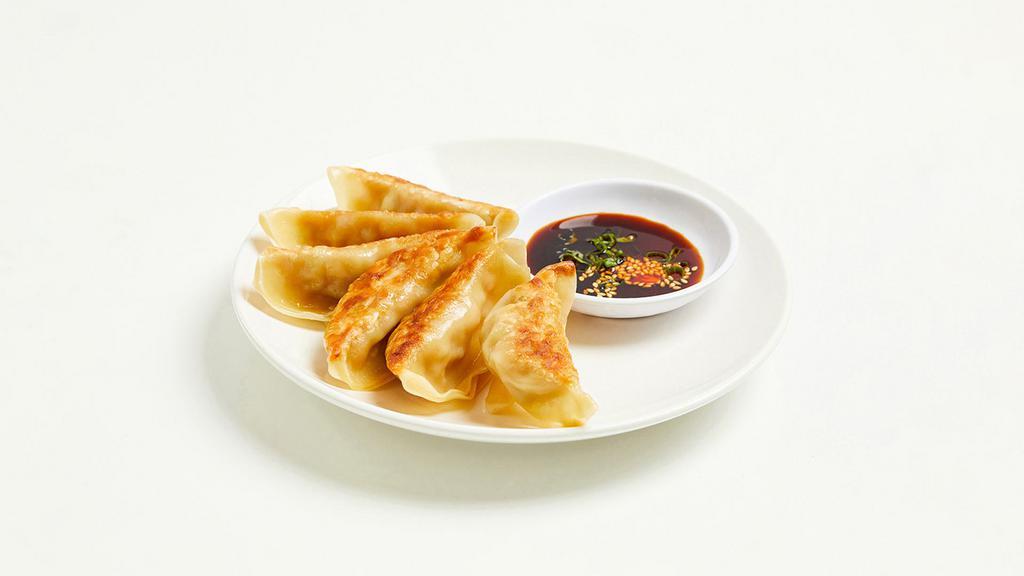 Gyoza · Fried dumplings with your choice of filling, served with a gyoza dipping sauce.