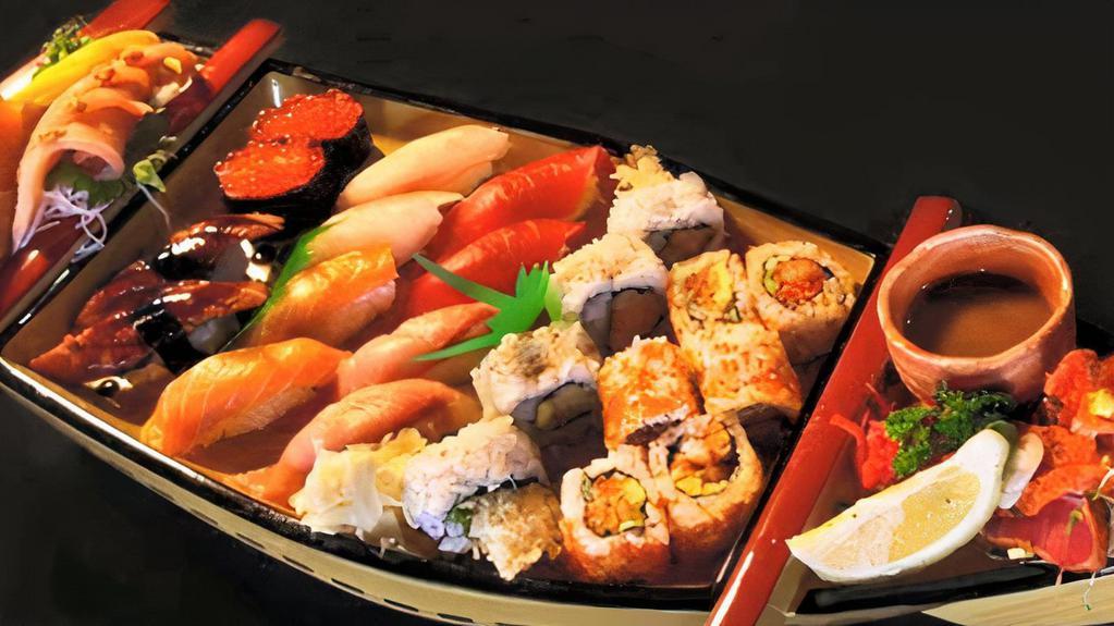 Love Boat For 2 · 10 pieces sashimi, 15 pieces sushi, eight pcs California roll and eight pieces spicy tuna roll.