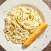 Chicken Alfredo · Fettuccine and creamy Housemade Alfredo sauce cooked with chicken breast meat and Parmesan.