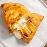 Mario'S Calzone · Shredded mozzarella, chorizo, bacon, bell pepper blend, caramelized onions, jalapeño.