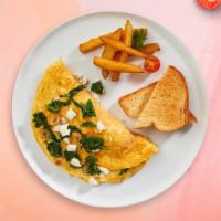 Geek Greek Omelette · Eggs cooked with feta cheese and tomato or spinach as an omelette or scrambled eggs served w...