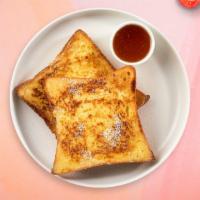 French Toast · Fresh bread battered in egg, milk, and cinnamon cooked until spongy and golden brown. Topped...