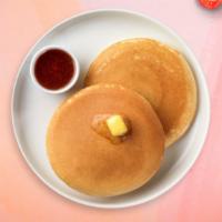 Pancakes · Fluffy pancakes cooked with care and love served with butter and maple syrup. Served in pairs.