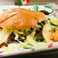 Torta · Bread stuffed with your choice of meat, beans, dressing, lettuce, tomato, onions, cilantro a...