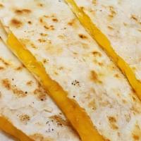 Cheese Quesadilla · Served with sour cream and Tasti salsa.