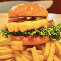 American Cheeseburger · Beef 6oz, Lettuce, Tomato, American Cheese, Pickles, Ketchup and Mayo. Includes French Fries