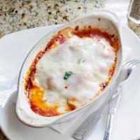 Beef Lasagna · Oven-baked layered meat Sauce, Ricotta, Mozzarella and pasta sheets in our marinara sauce, t...