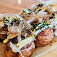 Takoyaki · Traditional Japanese stuffed octopus balls. Comes in 6 pieces. Topped with Takoyaki sauce, b...