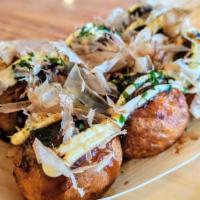 Takoyaki · 6 pieces of freshly fried Takoyaki with mayo, takoyaki sauce, seaweed flakes, and bonito fla...