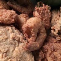 Fried Gulf Oysters · Fresh oysters, fried to perfection, served with hush puppies and one side.