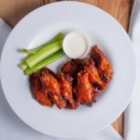 Tmt Wings · 8 of our delicious marinated wings fried crisp and tossed in any one of our wing sauces serv...