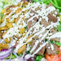 Opa Combo Salad · A combination of chicken and gyro meat on a greek salad topped with our homemade tzatziki sa...