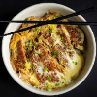Katsudon · Panko crusted pork cutlet, sliced onions, green onions, and egg  simmered in a special sauce...