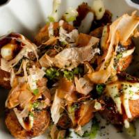 Takoyaki Plate · Octopus puffs mixed with green onions topped with takoyaki  sauce, pinto aioli, bonito flakes