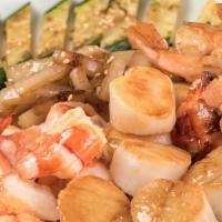 Seafood Combination · Grilled cold water lobster tail with grilled sea scallops and colossal shrimp.