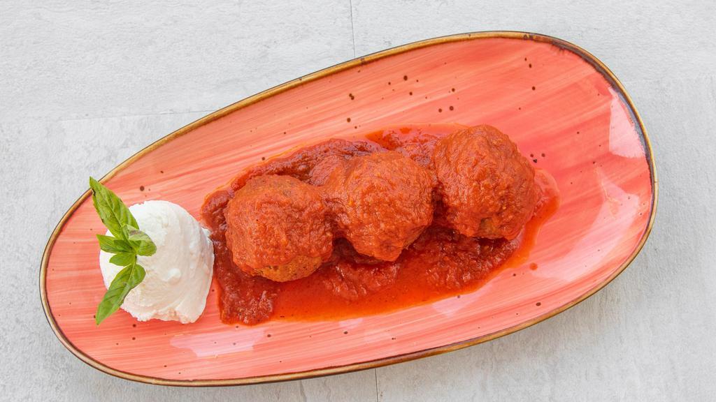 Polpette (Italian Meatballs) · Blend of beef and pork simmered in tomato sauce served with ricotta cheese.