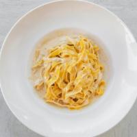 Fettuccine Alfredo · Fettuccine pasta in a white rich Alfredo sauce.