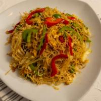 Singapore Noodles · Spicy, gluten free. Thin rice vermicelli wok tossed in a spicy aromatic curry seasoning alon...