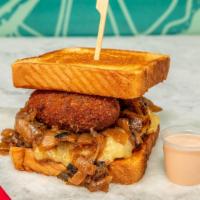 Latin Melt · Our house blend 1/2 lb burger topped with two chorizo croquettes, havarti cheese, and carame...