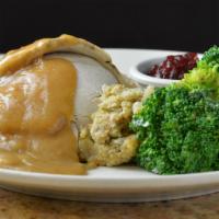 Lch Roasted Turkey & Dressing · Slow roasted, seasoned turkey breast sliced and served over cornbread dressing; finished wit...
