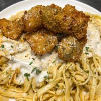 Wild Fried Oyster Fettuccine · Fettuccine Alfredo in creamy butter sauce topped with fried Japanese style pacific oysters i...