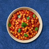 Champion Chickpea · Slow-cooked chickpeas with spices mixed with onion and tomatoes