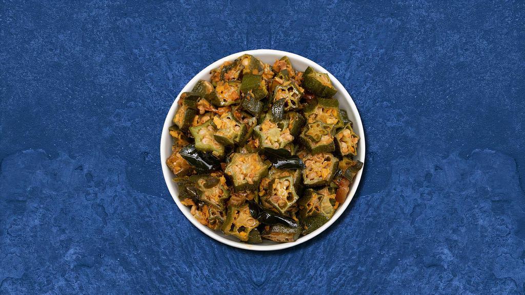 Stir Fried Okra  · Stir-fried okra cooked with onion, tomato, garlic and Indian spices