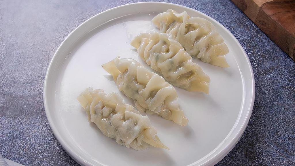 Pork Dumplings · Four steamed pork dumplings served with our Beijing sauce.