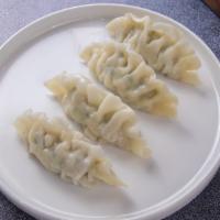 Beef Dumplings · Four steamed beef dumplings served with our Beijing sauce (Soy Sauce/Ginger).
