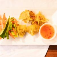Thai Steam Dumpling · Steamed dumplings stuffed of minced pork and shrimp. Served with Thai sweet chili sauce.